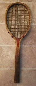 Antique unmarked wooden tennis racket.