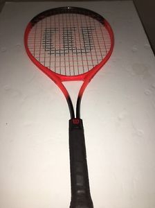 tennis racket wilson. rak attak jr 25 oversized orange / black