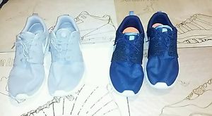 Two pairs of Nike air Roshes running jordan shoes 10.5