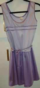 New silky purple tennis dress with matching tennis trunks. Excellent condition.