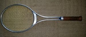 Vintage used Wilson Match Point Tennis Racquet, metal with original cover.
