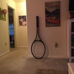 Think big huge tennis racket